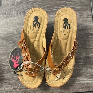 Brown wedge heels with flowers